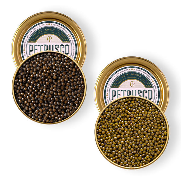 Two open gold tins of Petrusco caviar — dark brown Amur and olive-green Royal Ossetra — viewed from above.
