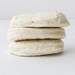 Load image into Gallery viewer, Two stacked Aphrodite Goat Milk Halloumi on a light gray background
