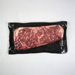 Load image into Gallery viewer, Vacuum-sealed raw steak on a white background
