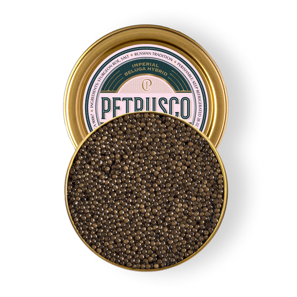 Open tin of Petrusco Imperial Beluga Hybrid caviar showing firm grey-brown pearls on a white background