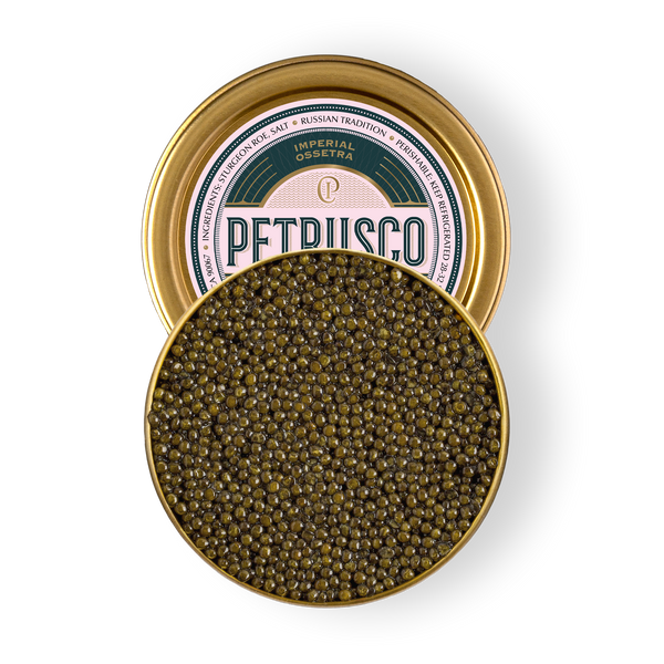 Open tin of Petrusco Imperial Ossetra caviar showing glossy olive-green pearls on a white background.