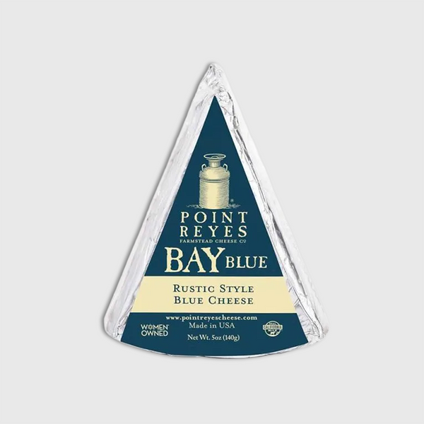 Triangular package of Point Reyes Bay Blue cheese on a light gray background