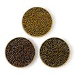 Load image into Gallery viewer, Close-up image of Royal Ossetra, River Beluga, and limited edition Amur caviar in tins.
