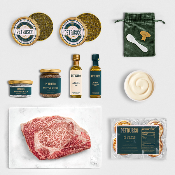 Collection of Petrusco food products including meat, truffle sauce, and truffle oil on a white background.