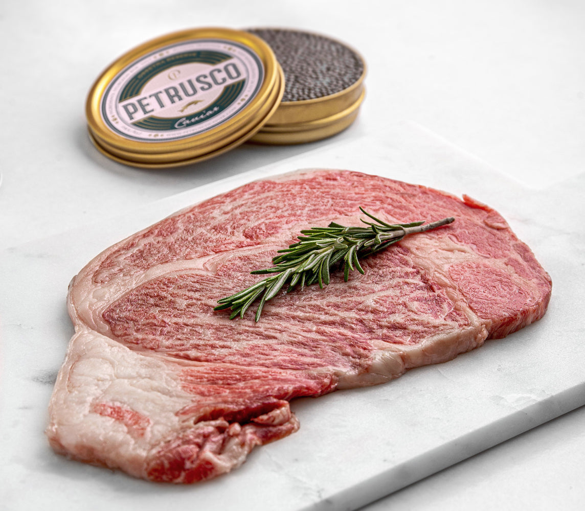 a raw piece of meat with Petrusco caviar behind it