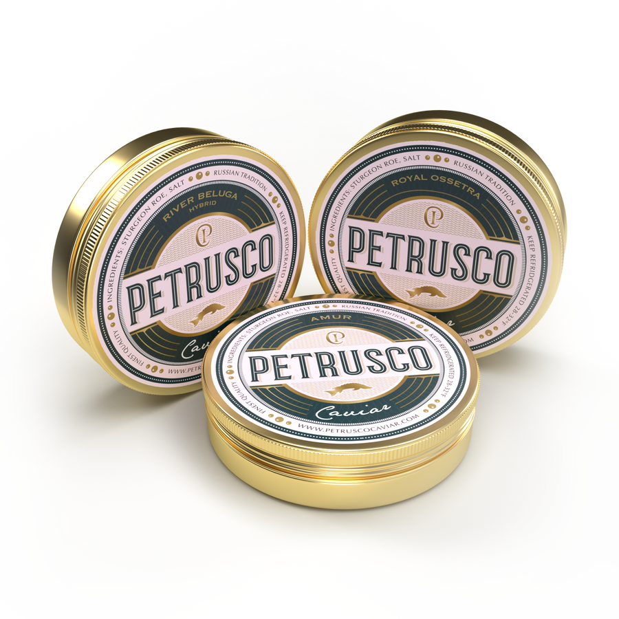 Closed tins of Royal Ossetra, River Beluga, and Amur caviar sit side by side.