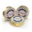 Load image into Gallery viewer, Closed tins of Royal Ossetra, River Beluga, and Amur caviar sit side by side.
